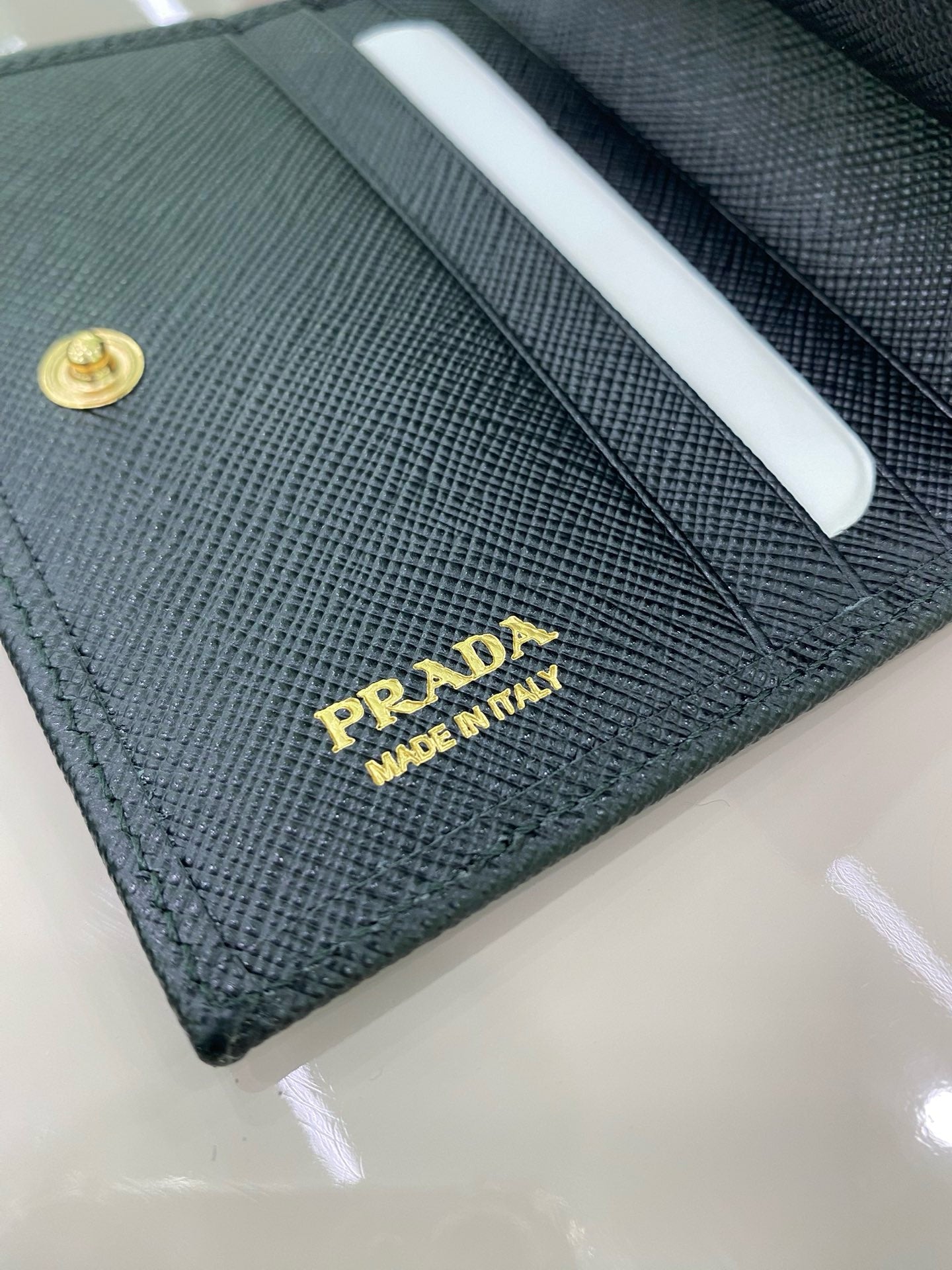 프라다 사피아노 삼각로고 코인 반지갑