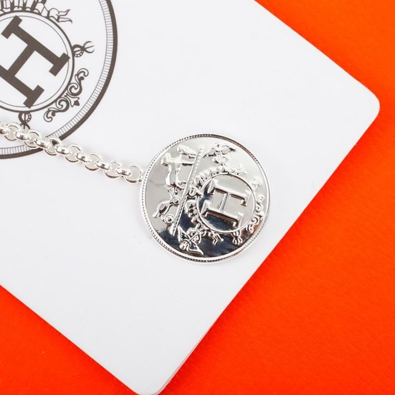 에르메스 Ex-Libris earrings