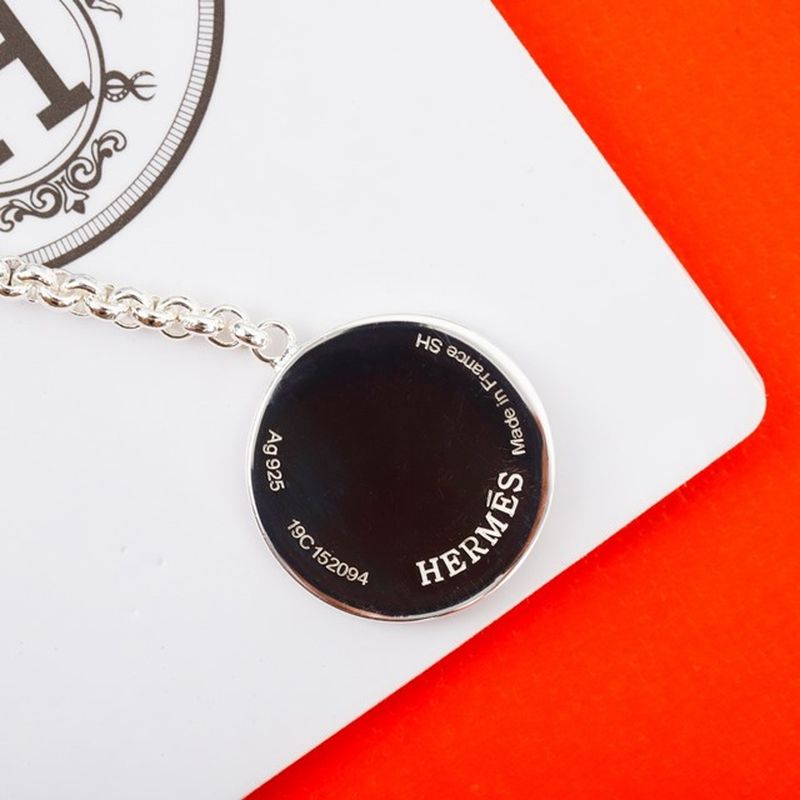 에르메스 Ex-Libris earrings